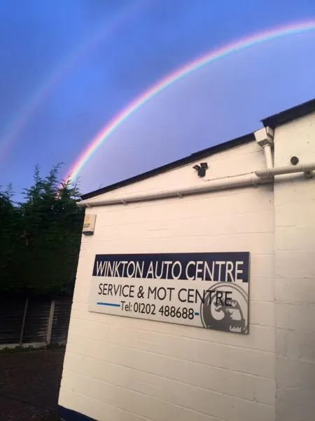A rainbow over the Winkton Auto Centre sign