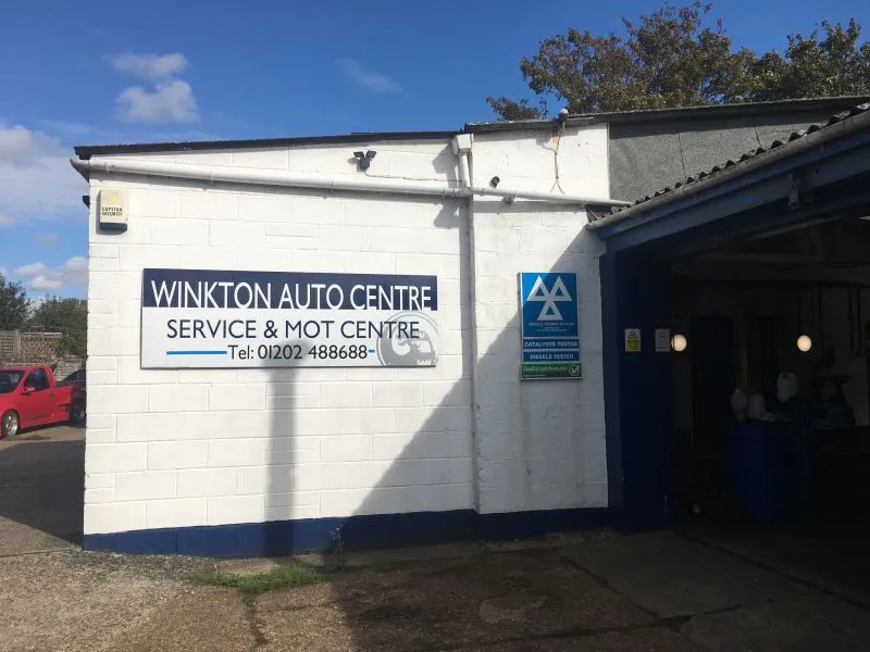 The Winkton Auto Centre workshop and its sign